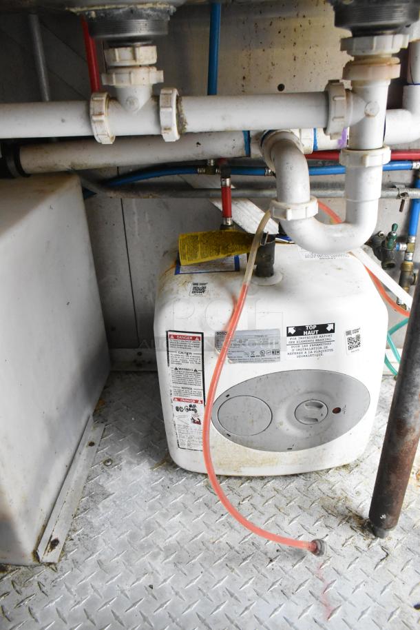 Cruising Kitchens 24' food trailer plumbing setup, featuring a Bosch water heater with visible labels and piping.