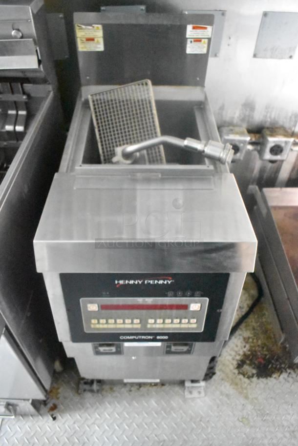 Henny Penny Computron 8000 commercial fryer in Cruising Kitchens food trailer, featuring stainless steel construction and digital controls.