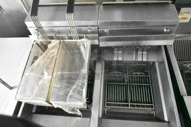 Cruising Kitchens mobile food trailer fryers, commercial-grade, stainless steel, excellent condition, with fryer baskets.