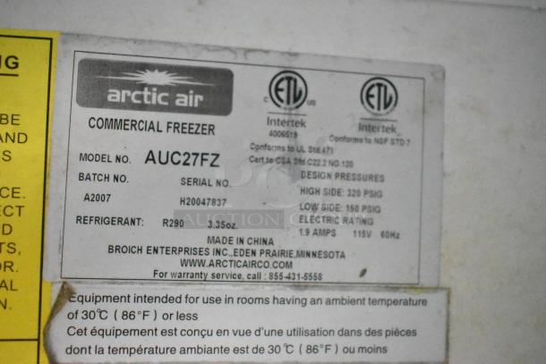 Label on Arctic Air commercial freezer, model AUC27FZ, shows specs including R290 refrigerant, 3.35 oz, 115V, 60Hz. Made in China.