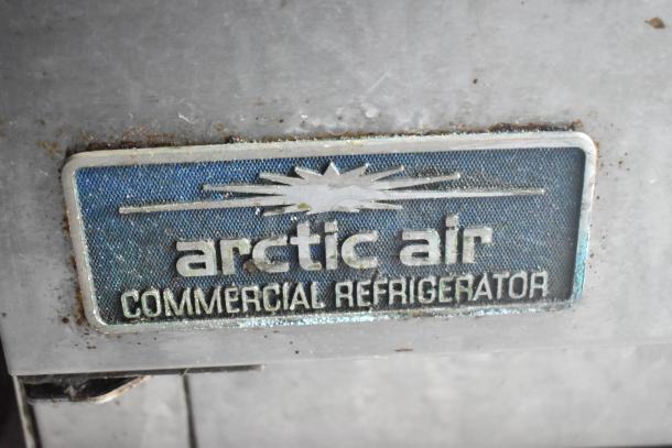 Arctic Air commercial refrigerator label on Cruising Kitchens food trailer, featuring essential kitchen appliances.