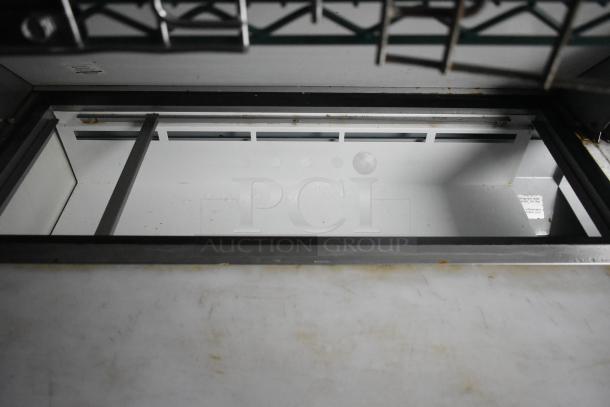 Interior view of Cruising Kitchens 24' food trailer, showcasing ample counter space and stainless-steel frame.