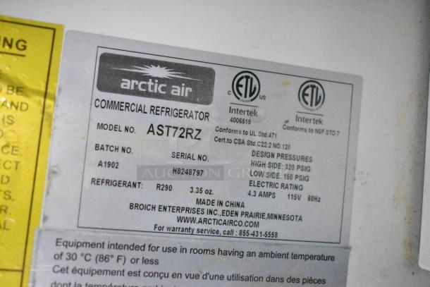 Label on Arctic Air Commercial Refrigerator, Model AST72RZ. Shows design pressures, refrigerant details, and certification marks.