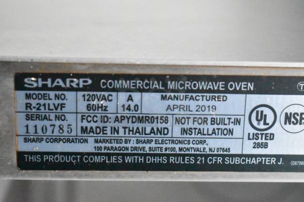 Sharp commercial microwave oven label showing model R-21LVF, manufactured April 2019, UL and NSF listed.