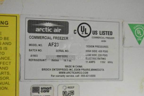 Label on Arctic Air commercial freezer model AF23, includes design pressures, refrigerant details, and contact info.
