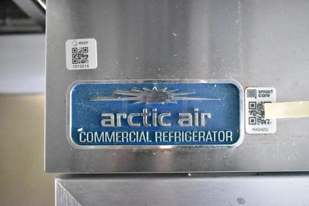 Arctic Air commercial refrigerator label with QR codes, part of Cruising Kitchens food trailer equipment.