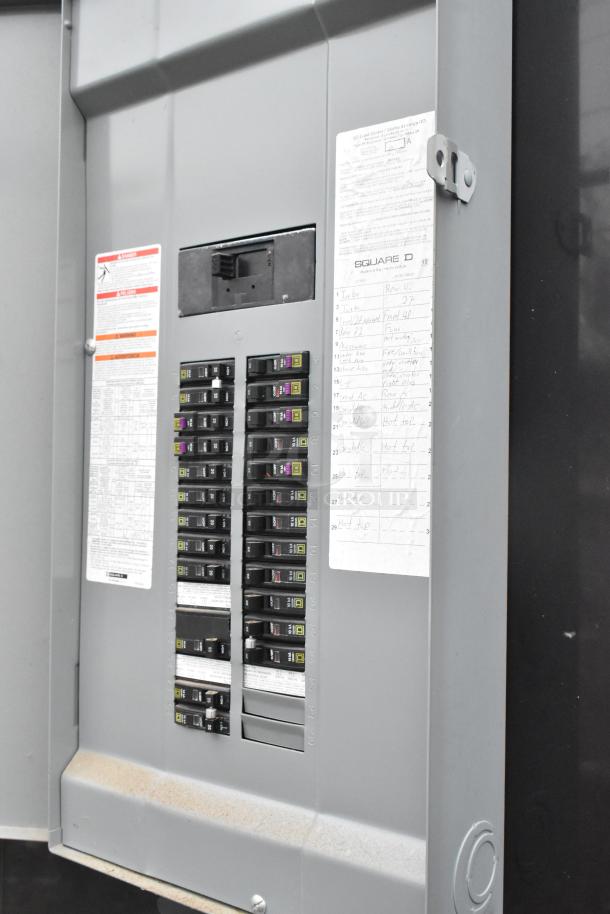 Electrical panel of 2021 ATX food trailer. Visible breaker switches and labels, essential for mobile kitchen setups.