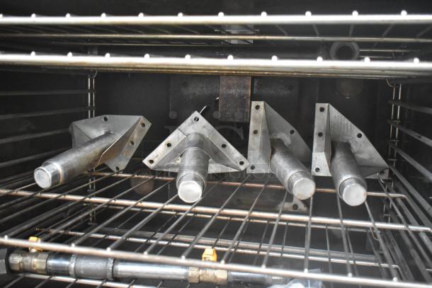 Stainless steel racks inside Vulcan VC6GD-SEFCAM convection oven, with brushed metal components.