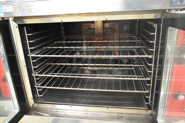 Vulcan VC6GD-SEFCAM commercial gas convection oven with stainless steel finish, view-through doors, and metal racks.