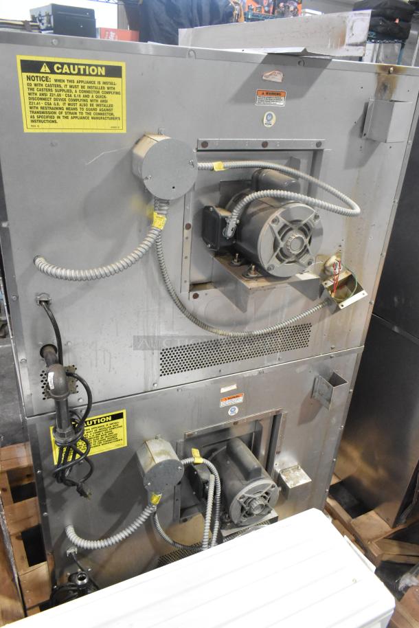 Vulcan VC6GD-SEFCAM stainless steel convection oven, gas-powered, thermostatic controls, view-through doors, metal racks.