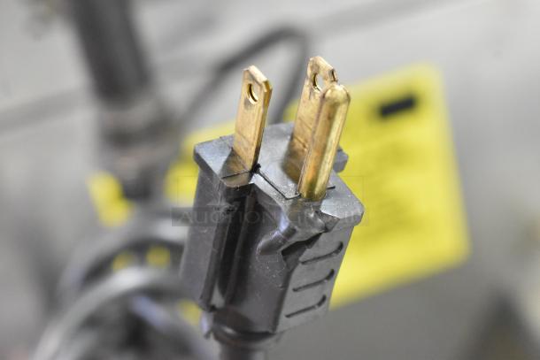 Close-up of a two-pronged electrical plug for the Vulcan VC6GD-SEFCAM gas convection oven.