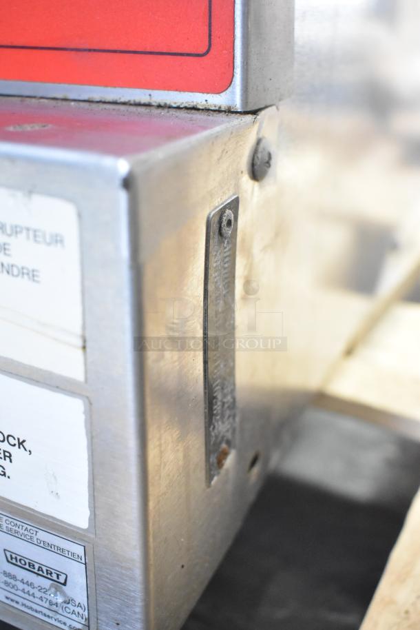 Vulcan VC6GD-SEFCAM5 stainless steel convection oven corner, showing labels and metal surface details.