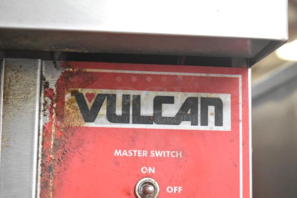 Vulcan VC6GD-SEFCAM oven panel with branding, showing signs of wear, master switch with on/off options.