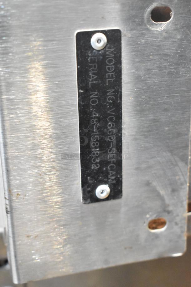 Vulcan VC6GD-SEFCAM convection oven label showing model and serial number on stainless steel.