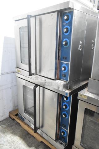 Duke 6/13 stainless steel commercial convection ovens, stacked, gas powered, view-through and solid doors, metal racks, thermostatic controls.