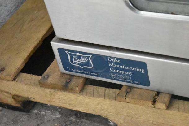 Duke 6/13 stainless steel commercial gas convection oven, full-size, view and solid doors, metal racks, thermostatic control.