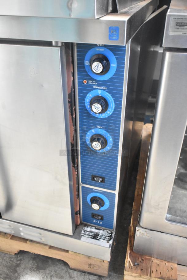 Duke 6/13 stainless steel gas convection oven, featuring view-through door, solid door, metal racks, thermostatic controls.