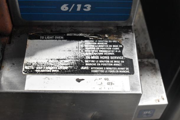 Duke 6/13 stainless steel convection oven, tags show worn gas relighting instructions. Auction includes two units.