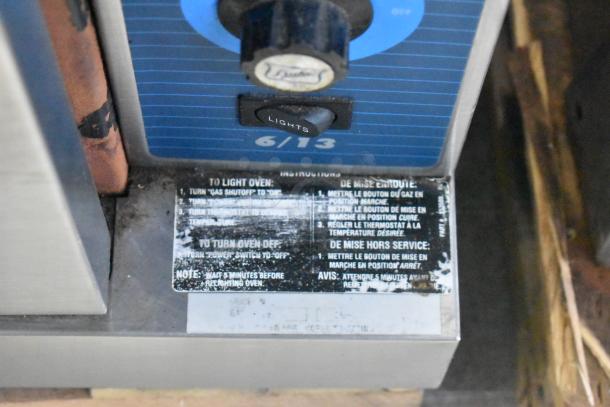 Duke 6/13 stainless steel convection oven control panel with light switch, instructions label, and thermostat dial.