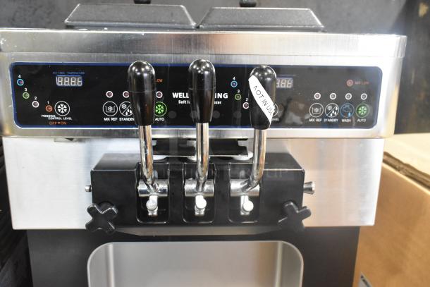 Wellspring SSI-143S stainless steel soft serve ice cream machine, 2 flavors with twist, commercial casters, 220V, 1-phase.