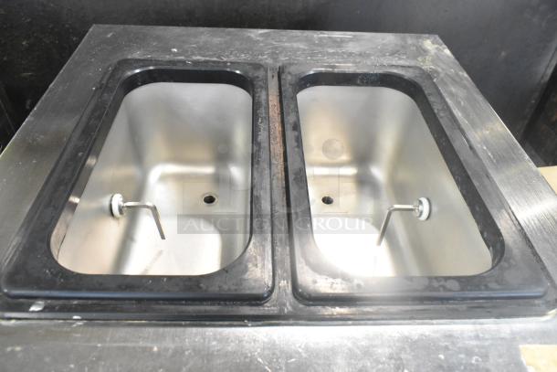 Wellspring SSI-143S soft serve machine, dual stainless steel containers, commercial casters, 220V, 1 phase, floor style.