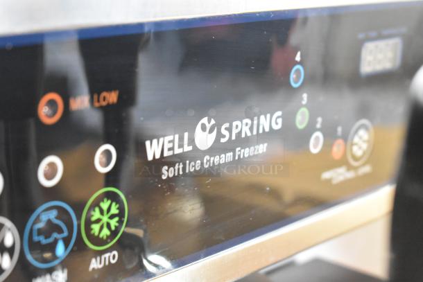 Wellspring SSI-143S soft serve ice cream machine with commercial casters, stainless steel, 2 flavors with twist, 220V, 1 phase.