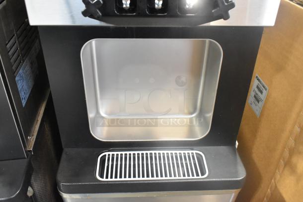 Wellspring SSI-143S stainless steel soft serve machine, 2 flavors with twist, on casters, 220V, 1 phase, commercial use.