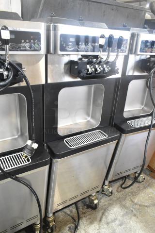 Wellspring SSI-143S stainless steel 2-flavor ice cream machine with twist feature, on commercial casters, 220V, 1 Phase.