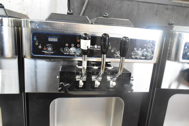 Wellspring SSI-143S soft serve machine, stainless steel, 2 flavors with twist, control panel and levers visible, on casters.