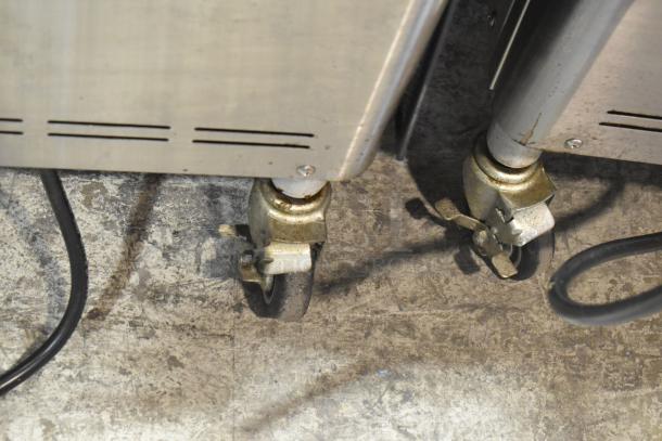 Wellspring SSI-143S ice cream machine casters, stainless steel, commercial-grade, floor style, slightly worn condition.
