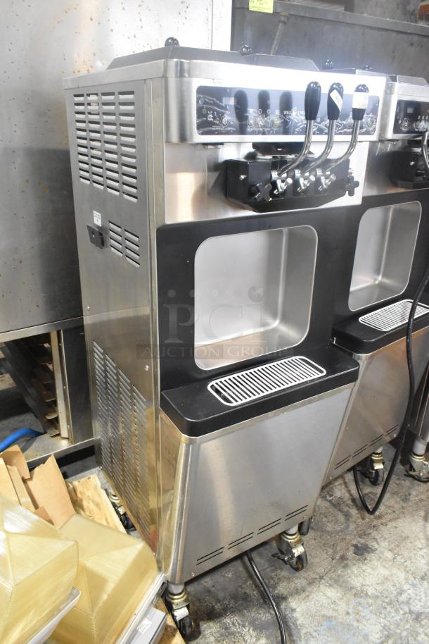 Wellspring SSI-143S stainless steel 2-flavor soft serve ice cream machine on casters, 220V, commercial use, good condition.