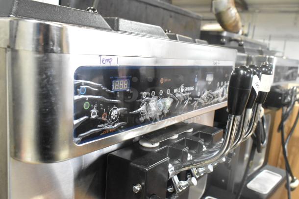 Wellspring SSI-143S soft serve ice cream machine, stainless steel, two flavors with twist, control panel, on commercial casters.