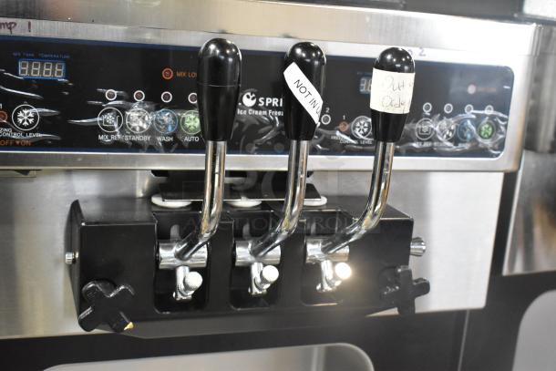 Wellspring SSI-143S stainless steel soft serve ice cream machine, 2 flavor with twist, on casters, 220V, 1 phase, control panel visible.