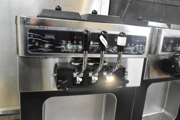 Wellspring SSI-143S stainless steel soft serve machine, 2 flavor w/ twist, commercial casters, labels showing "out of order".