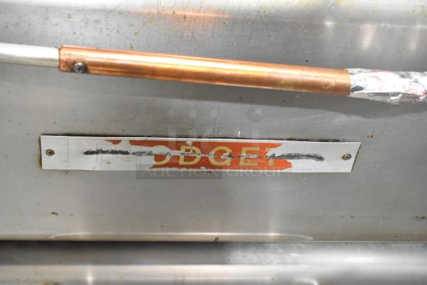 Blodgett stainless steel commercial gas pizza oven with worn brand label, includes cooking stones.