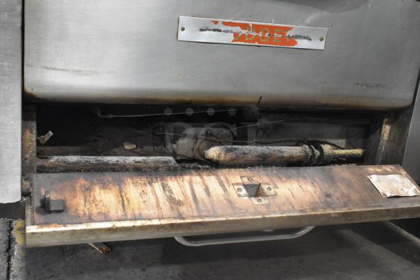 Blodgett stainless steel commercial gas pizza ovens with cooking stones, showing use and wear. Needs cleaning and maintenance.