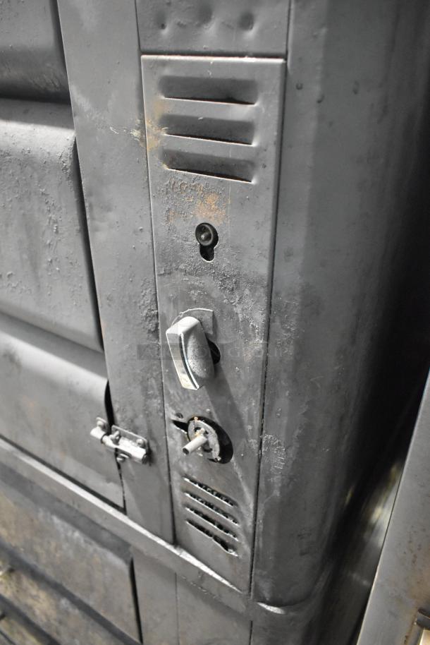 Blodgett 981 stainless steel commercial pizza oven detail, showing control panel with knobs and vent, natural wear evident.