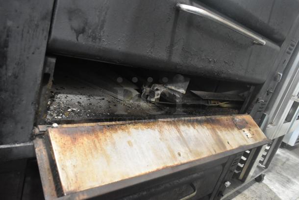 Blodgett 981 stainless steel 2-deck pizza oven, natural gas, 50,000 BTU, visible wear, industrial setting.