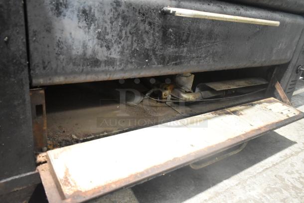 Blodgett 981 stainless steel commercial pizza oven, natural gas, 50,000 BTU. Visible wear, open deck, dual oven units.