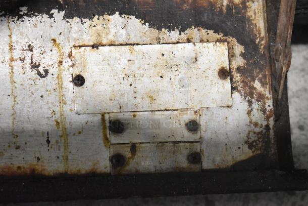 Close-up of a Blodgett 981 pizza oven label. Shows wear and rust, with visible model information and specifications.