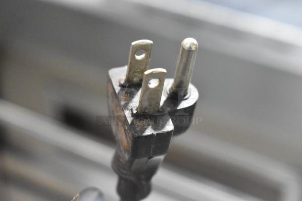 3-prong plug for Bregani 42330 metal espresso grinder. 120 volts, 1 phase. Note rust and wear on plug for condition.