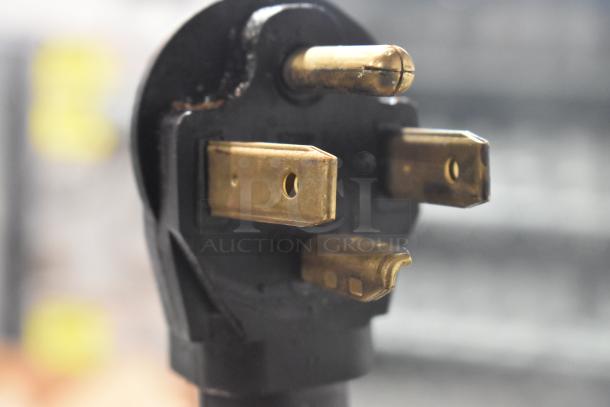 Close-up of an electric plug for the 2023 Lotus PCT-66ET stainless steel 4 burner hot plate range, 220-240 volts.