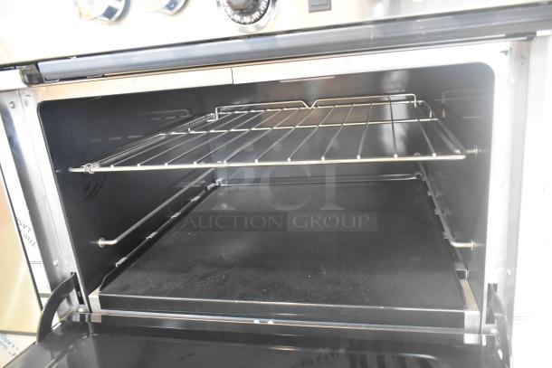 BRAND NEW Southbend 4601DD stainless steel 10 burner range. Open oven with rack shown. 45,000 BTU, natural gas.
