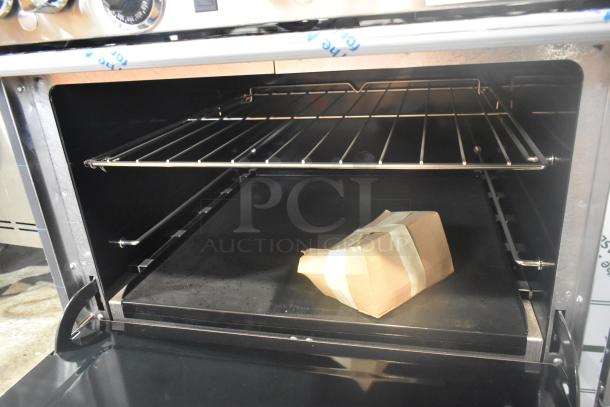 Interior of the Southbend 4601DD oven, showing a rack and a wrapped package. Brand new condition.