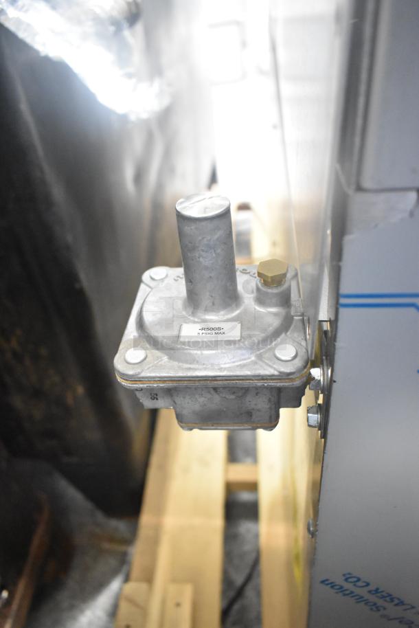 Rear view of Southbend 4601DD 10 burner range component with visible gas regulator. Marked 5 PSIG MAX. Stainless steel.