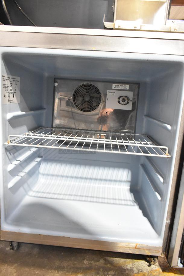 Delfield 406CA-DD1 stainless steel undercounter cooler, single door, shelf, 115 volts, 1 phase, good condition.