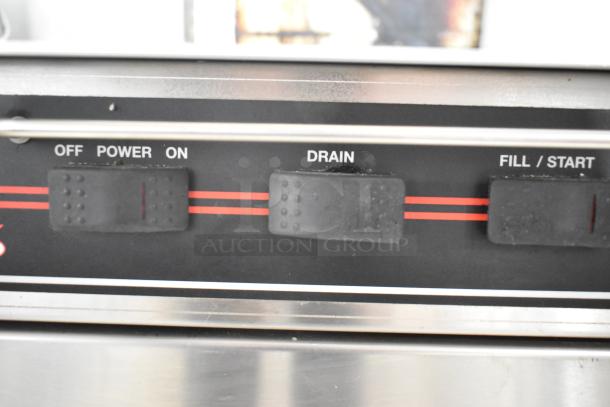 CMA L-1X16 stainless steel undercounter dishwasher controls with "Off," "Power," "Drain," "Fill/Start" labels.