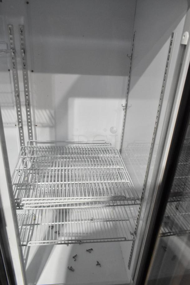 Cooler Depot LG-1000BF commercial 2-door reach-in cooler with poly coated racks; interior view, 115V, good condition.