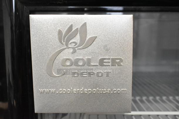 Cooler Depot LG-1000BF metal commercial two-door reach-in cooler with poly-coated racks. Features brand logo and website.