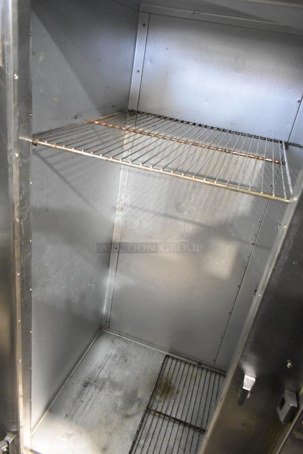Traulsen AHT 2-32 WUT stainless steel commercial 2-door reach-in cooler with racks. Good condition, 115V, 1 phase.